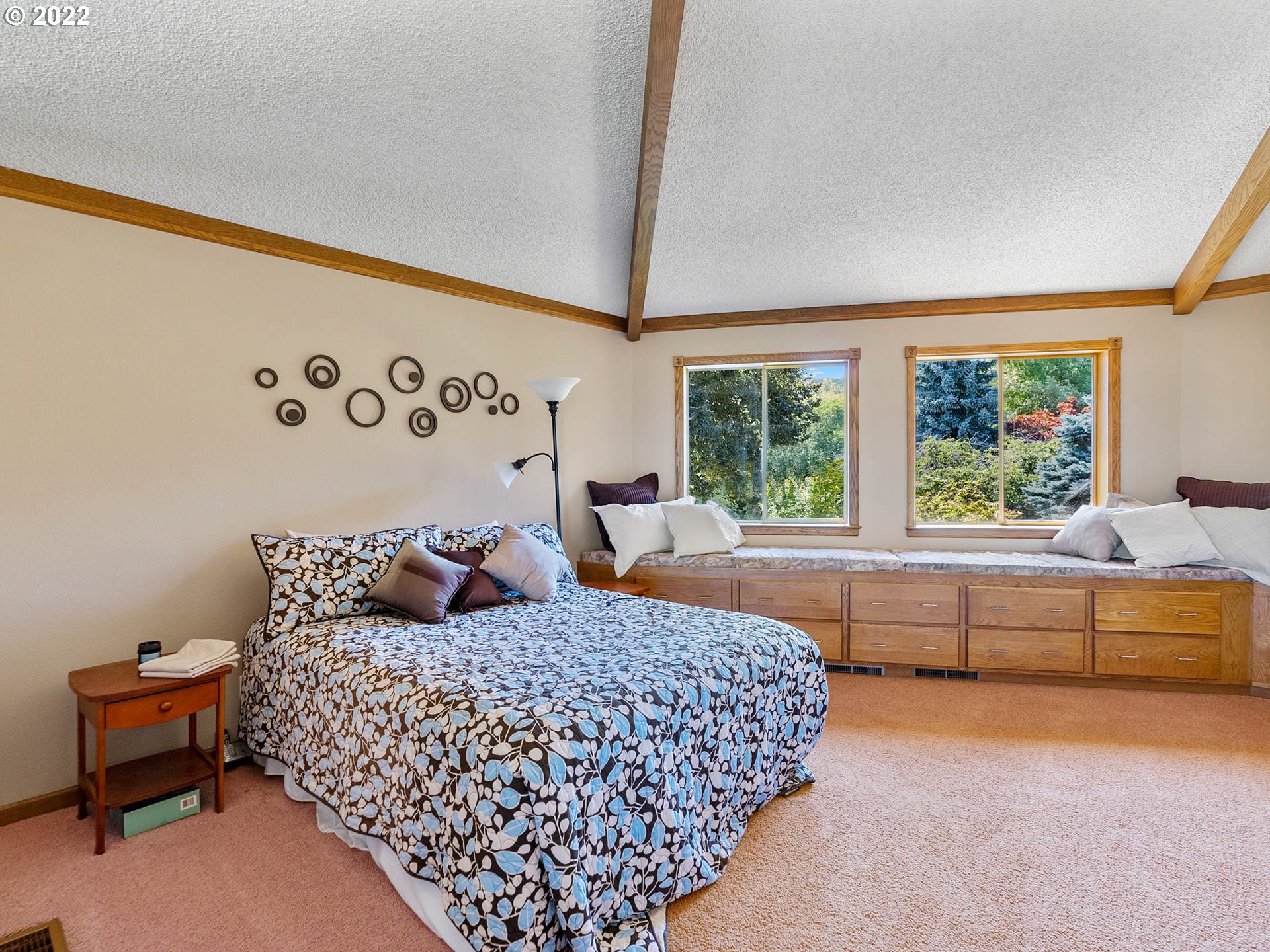38000 Southwest Nursery Road Cornelius, OR 97113 - Photo 19 of 40 a bedroom with a large bed and a couch next to a window