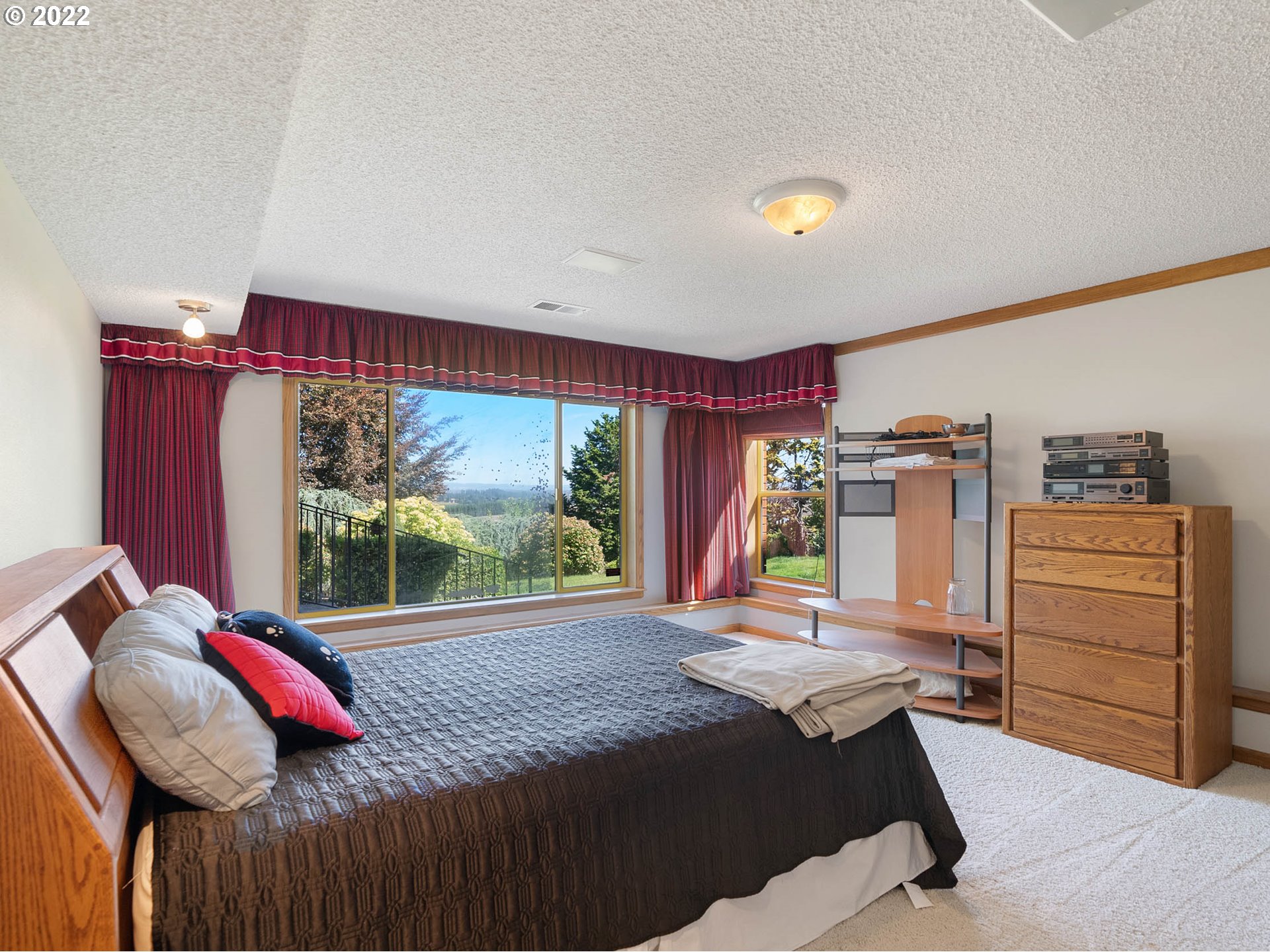 38000 Southwest Nursery Road Cornelius, OR 97113 - Photo 25 of 40 a bed sitting in a bedroom next to a window
