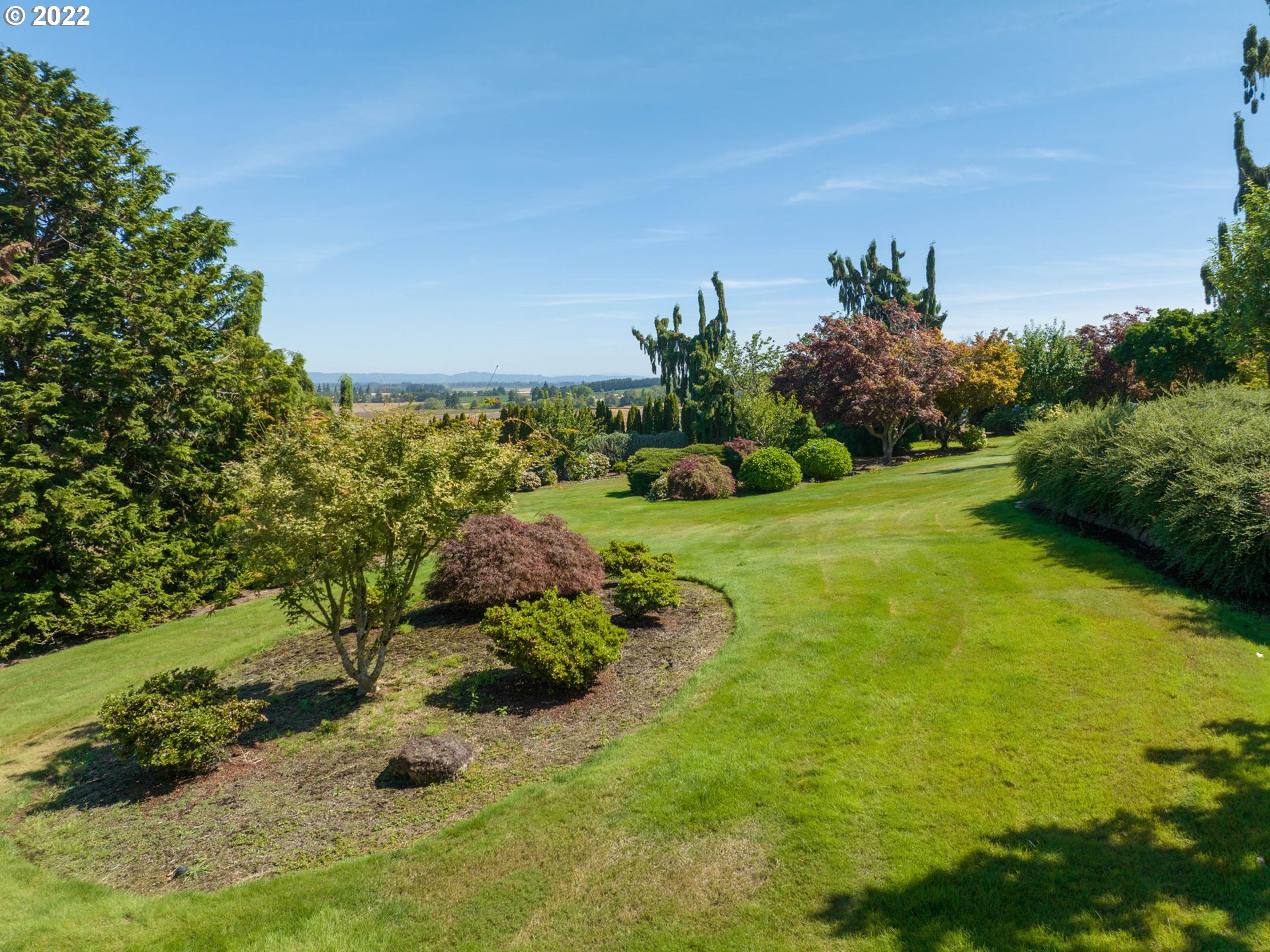 38000 Southwest Nursery Road Cornelius, OR 97113 - Photo 27 of 40 a view of a garden with a building in the background