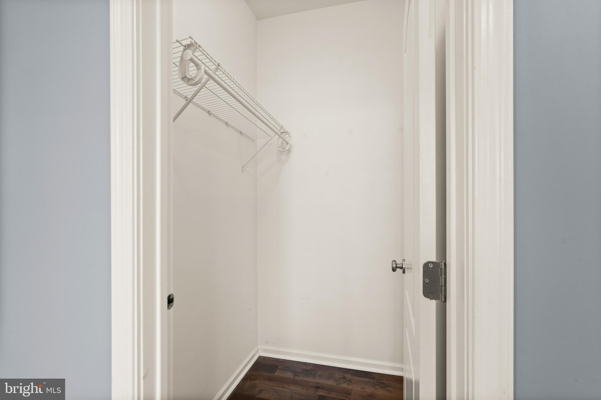 42988 Atoka Manor Terrace Ashburn, VA 20148 - Photo 11 of 47 a view of a hallway with wooden floor