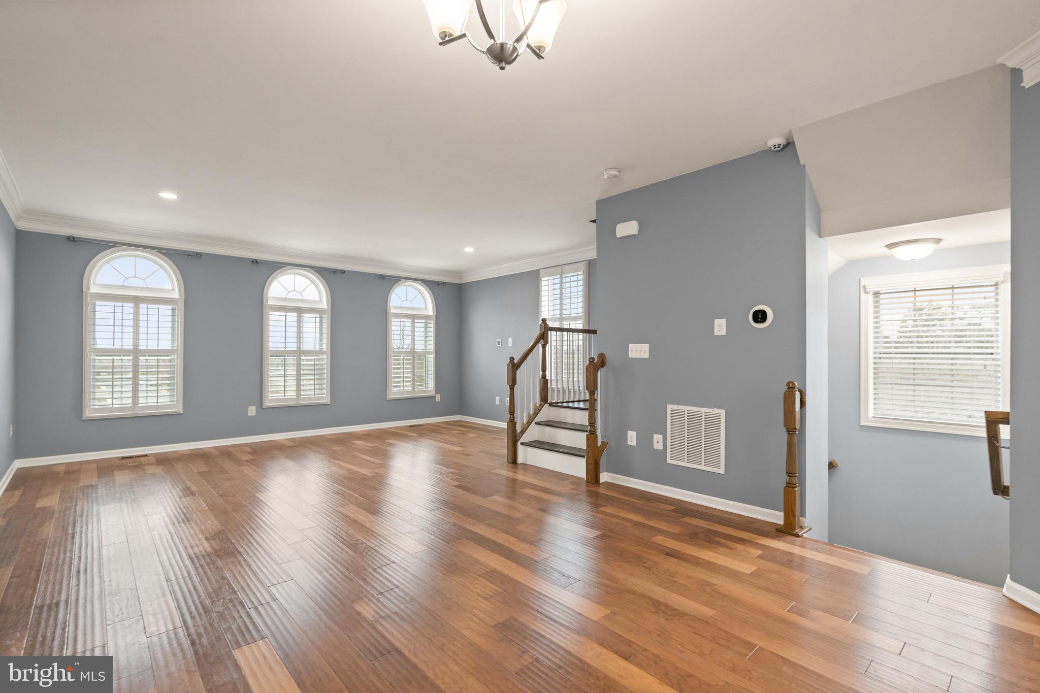 42988 Atoka Manor Terrace Ashburn, VA 20148 - Photo 12 of 47 a view of empty room with wooden floor and fan