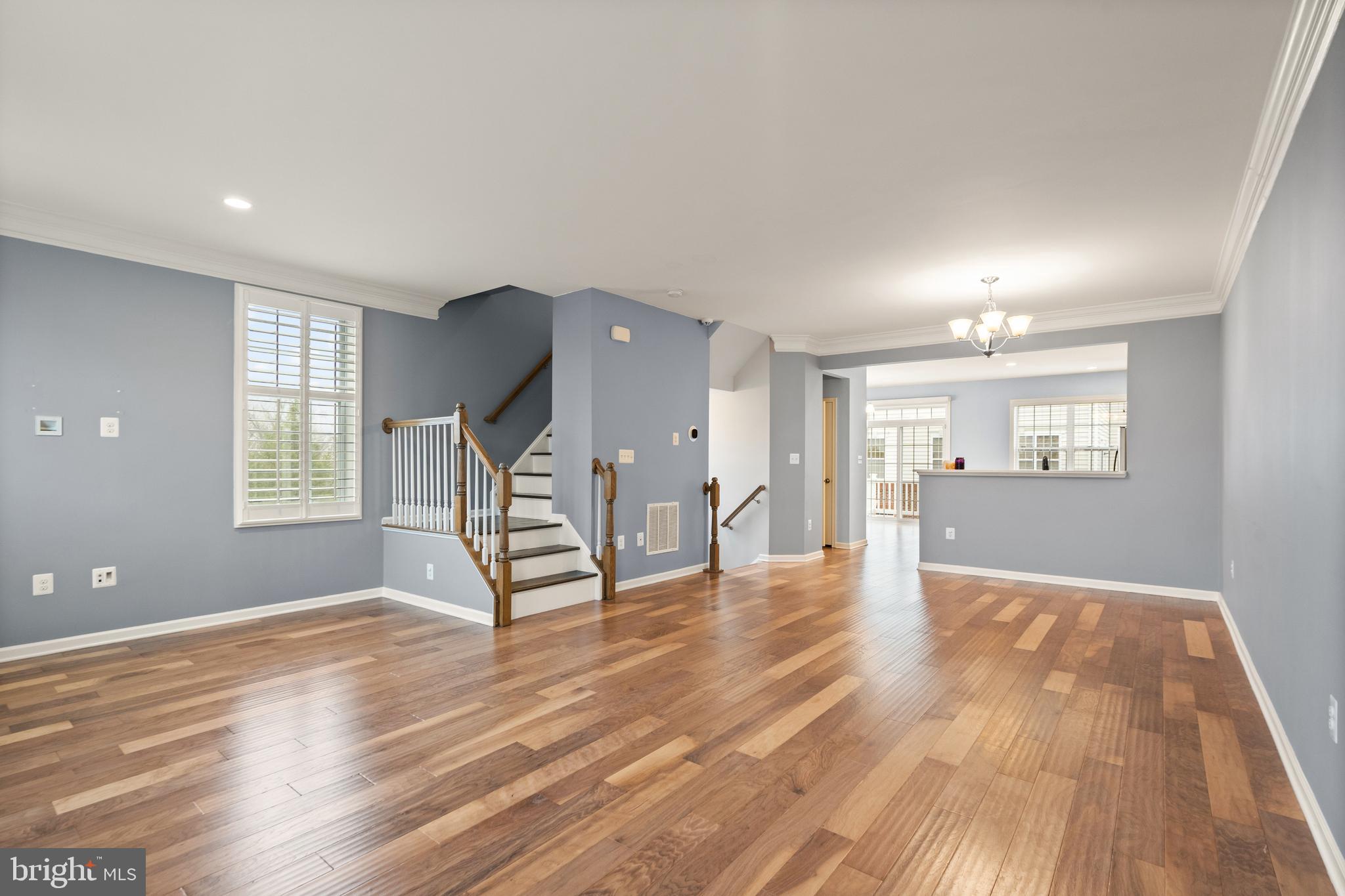 42988 Atoka Manor Terrace Ashburn, VA 20148 - Photo 13 of 47 wooden floor in an empty room with a window