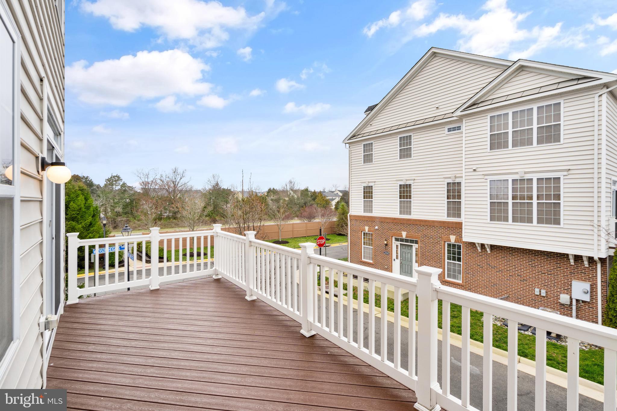 42988 Atoka Manor Terrace Ashburn, VA 20148 - Photo 25 of 47 a view of a house with wooden deck