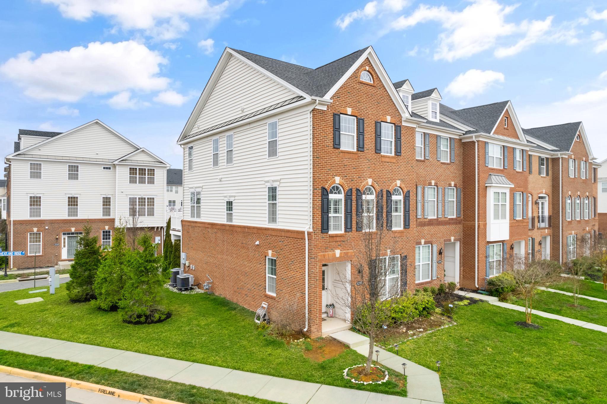 42988 Atoka Manor Terrace Ashburn, VA 20148 - Photo 3 of 47 front view of house with a yard