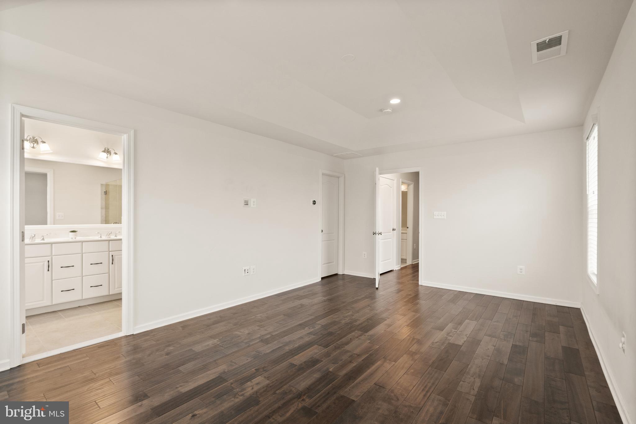 42988 Atoka Manor Terrace Ashburn, VA 20148 - Photo 31 of 47 wooden floor in an empty room with a window