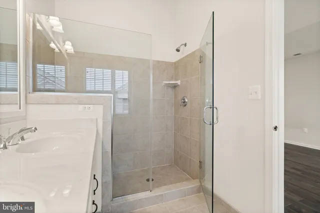 a bathroom with a bathtub and shower