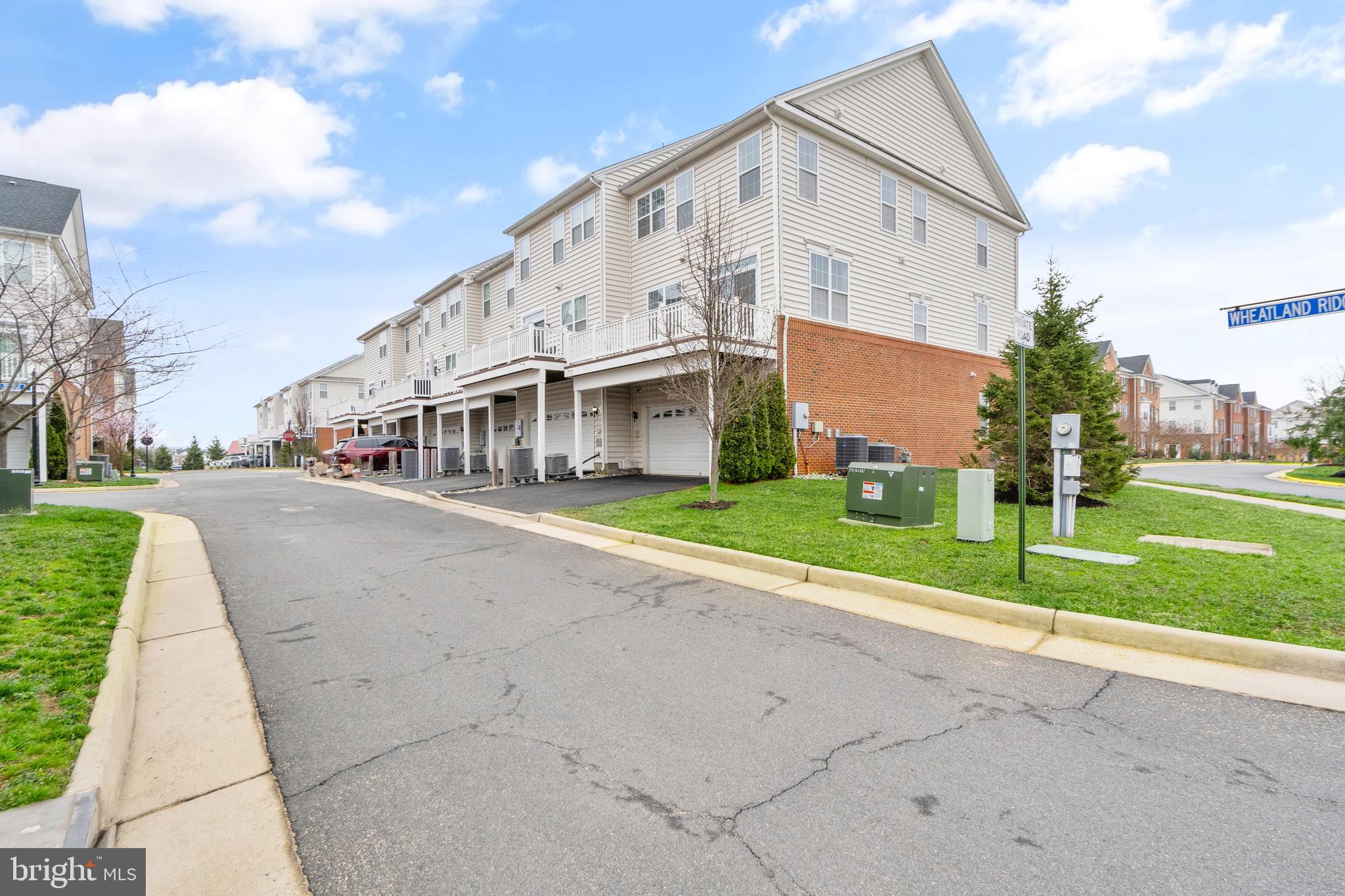 42988 Atoka Manor Terrace Ashburn, VA 20148 - Photo 44 of 47 a view of a white house with a yard