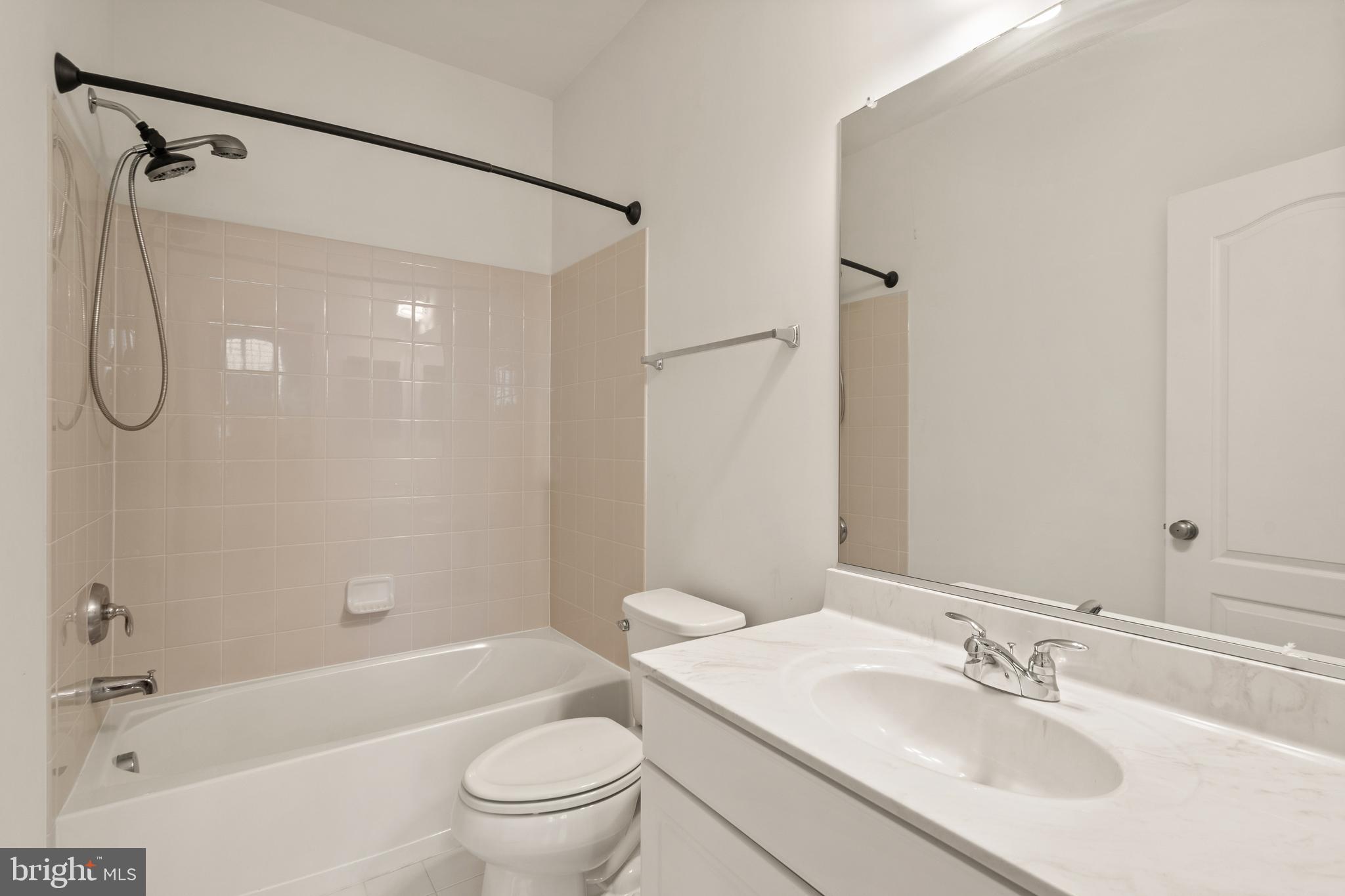 42988 Atoka Manor Terrace Ashburn, VA 20148 - Photo 10 of 47 a bathroom with a sink toilet tub and shower