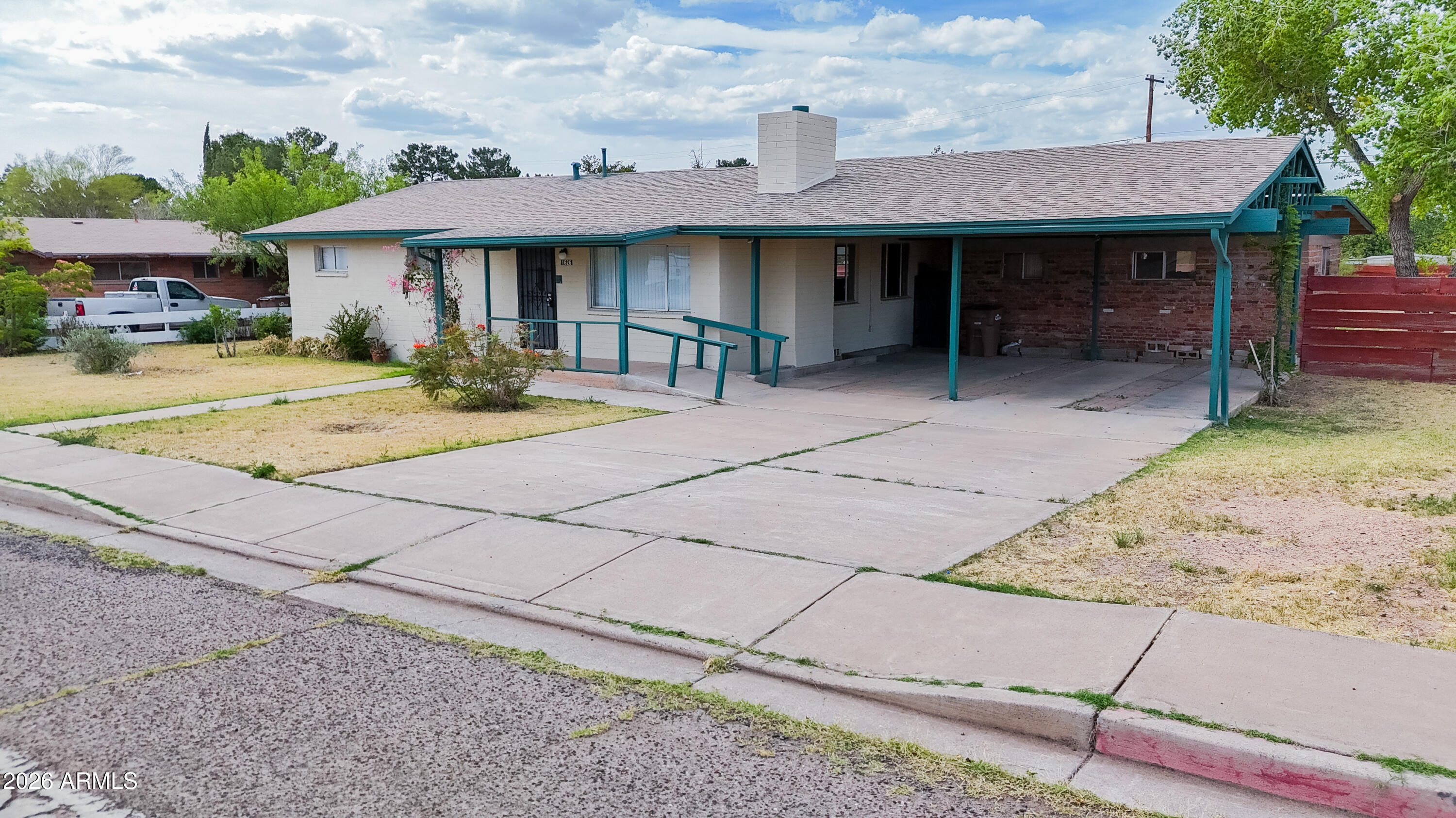 1626 11th Street Douglas, AZ 85607 - Photo 8 of 30 a front view of a house with garden