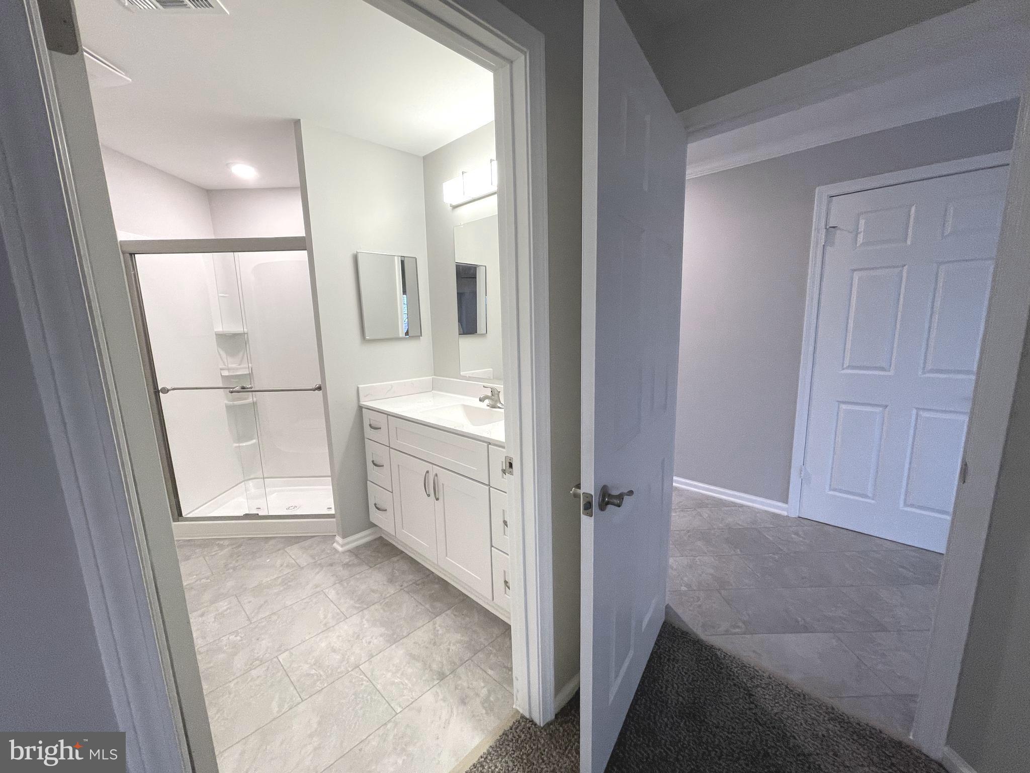2507 Shelley Circle, Unit 42B Frederick, MD 21702 - Photo 17 of 30 a bathroom with a double vanity sink and mirror