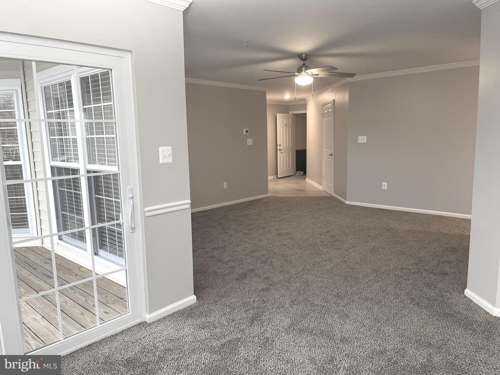 2507 Shelley Circle, Unit 42B Frederick, MD 21702 - Photo 19 of 30 an empty room with windows and ceiling fan