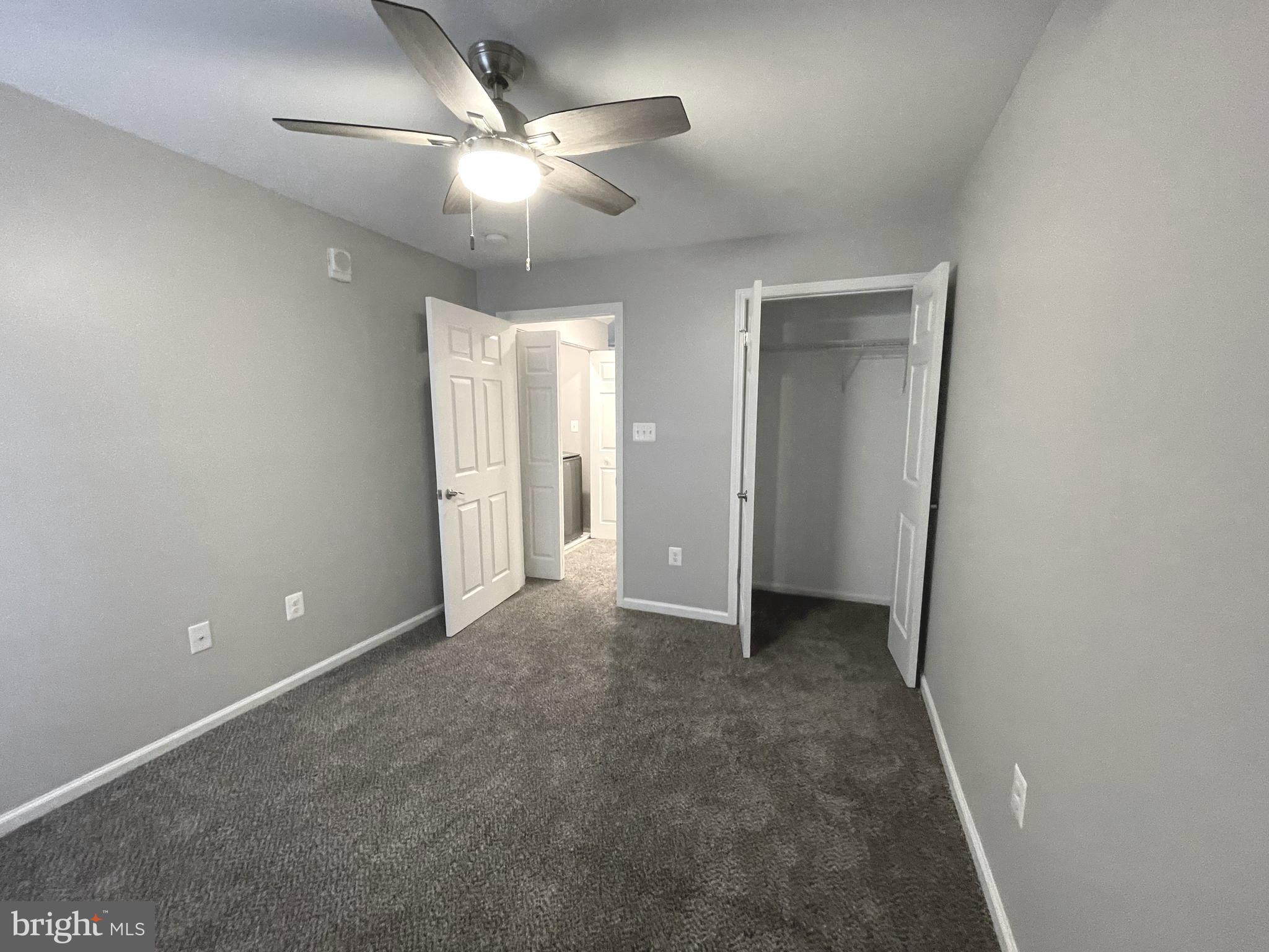 2507 Shelley Circle, Unit 42B Frederick, MD 21702 - Photo 28 of 30 an empty room with closet and a ceiling fan