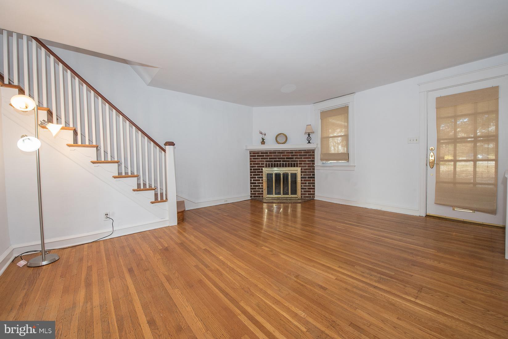 623 Kenilworth Road Ardmore, PA 19003 - Photo 5 of 22 Living Room with brick fireplace