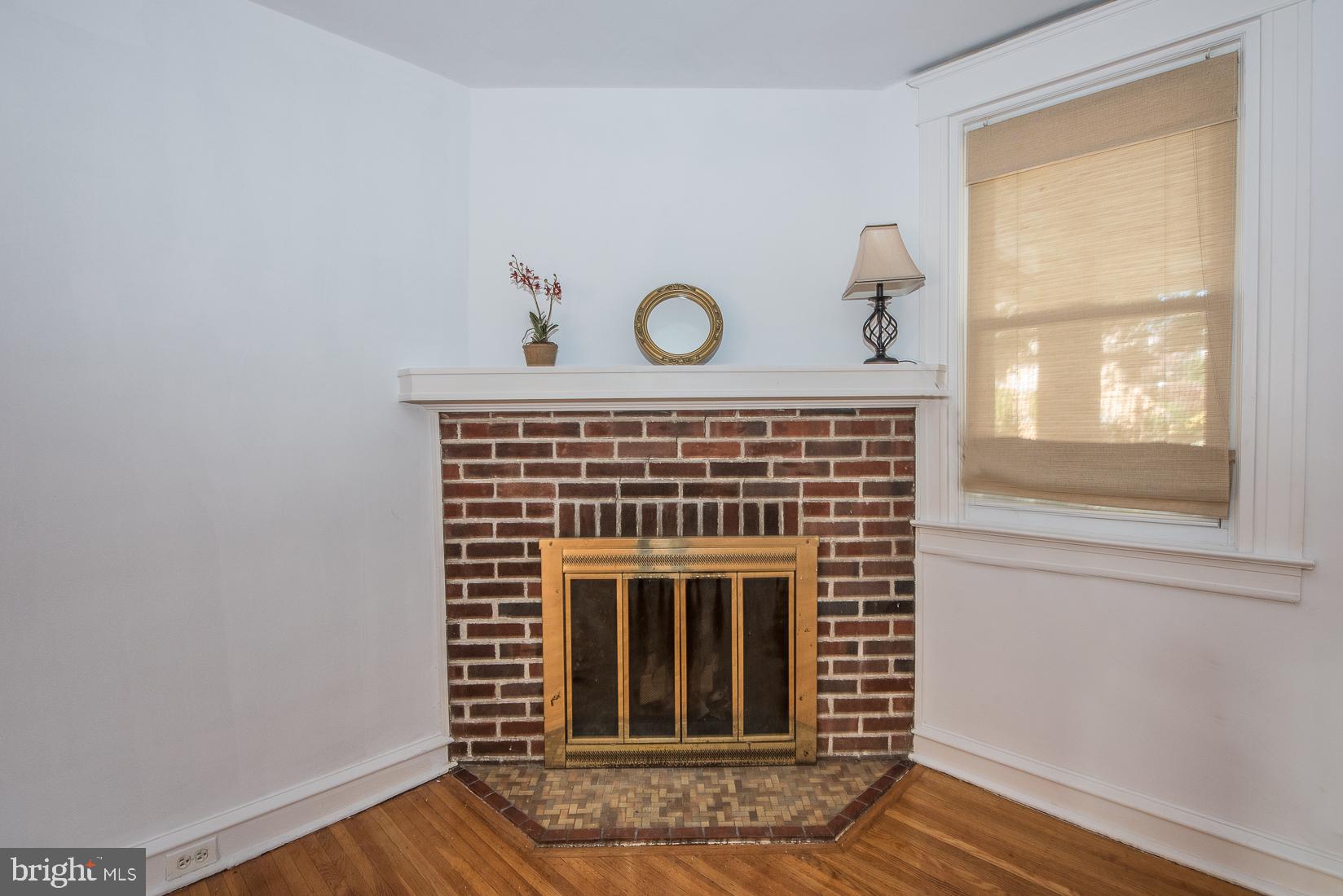 623 Kenilworth Road Ardmore, PA 19003 - Photo 6 of 22 Woodburning fireplace with glass doors