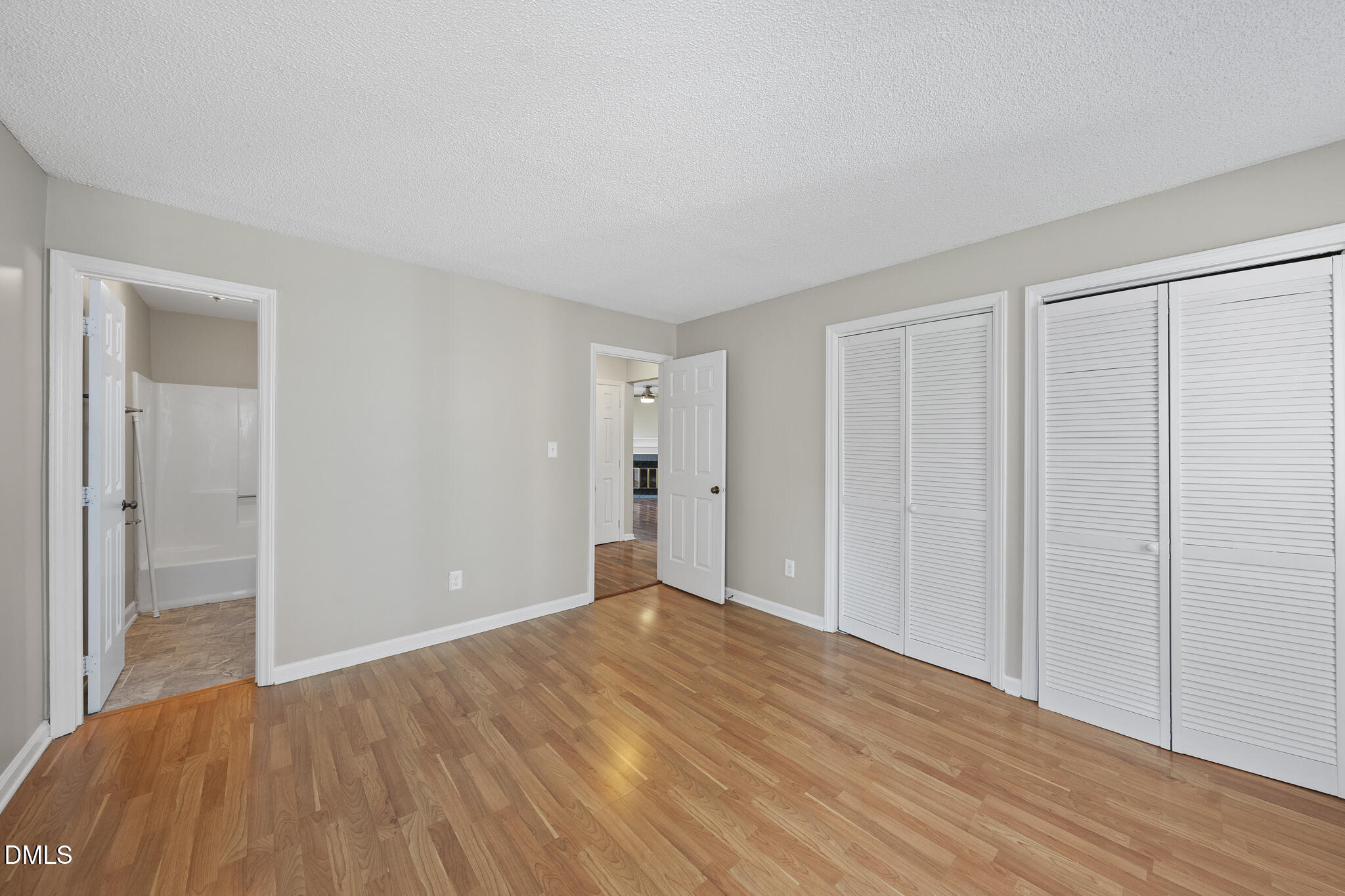 4601 Timbermill Court, Unit 104 Raleigh, NC 27612 - Photo 11 of 24 a view of empty room with wooden floor