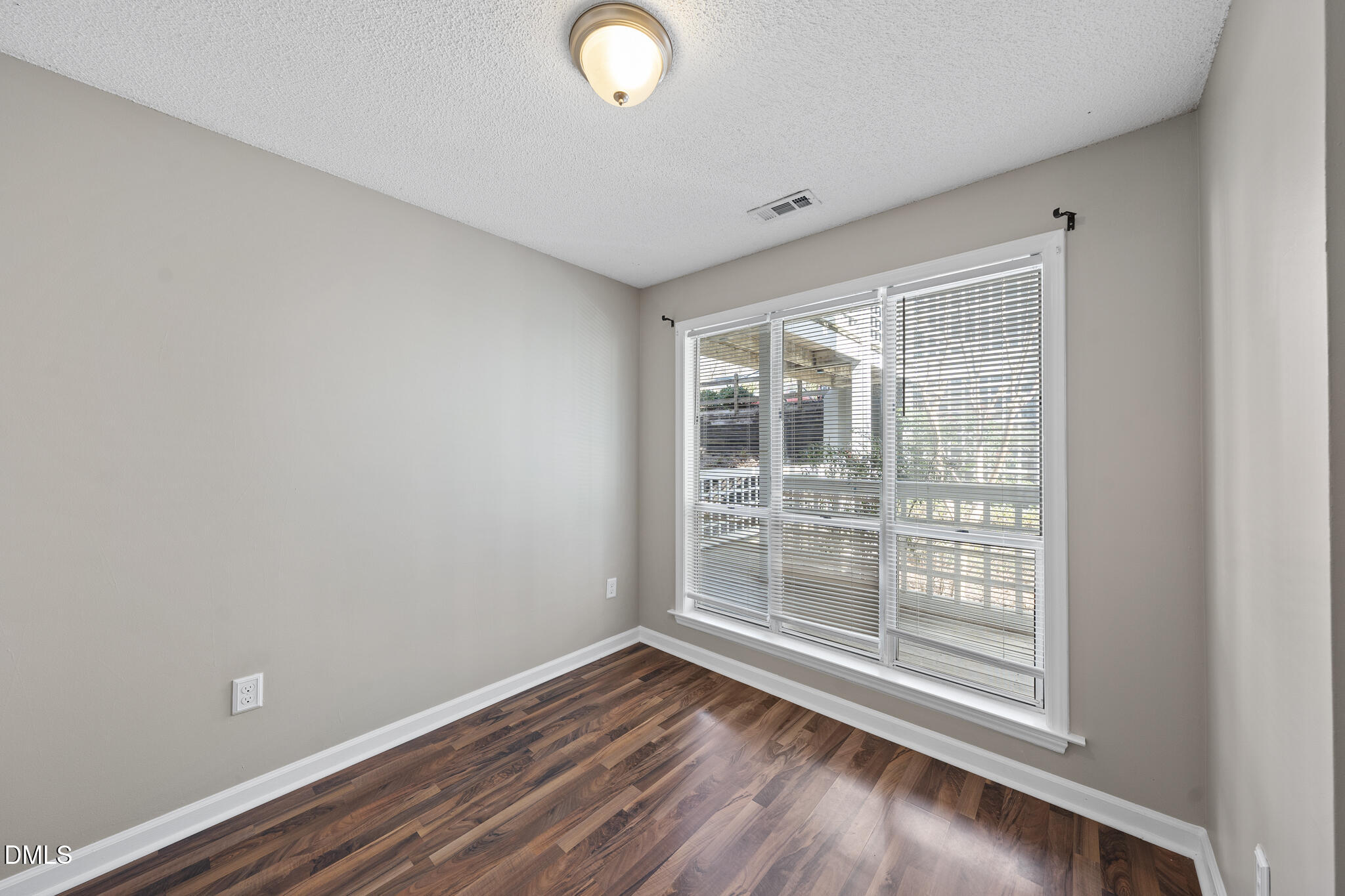 4601 Timbermill Court, Unit 104 Raleigh, NC 27612 - Photo 20 of 24 a view of room with window and hardwood floor