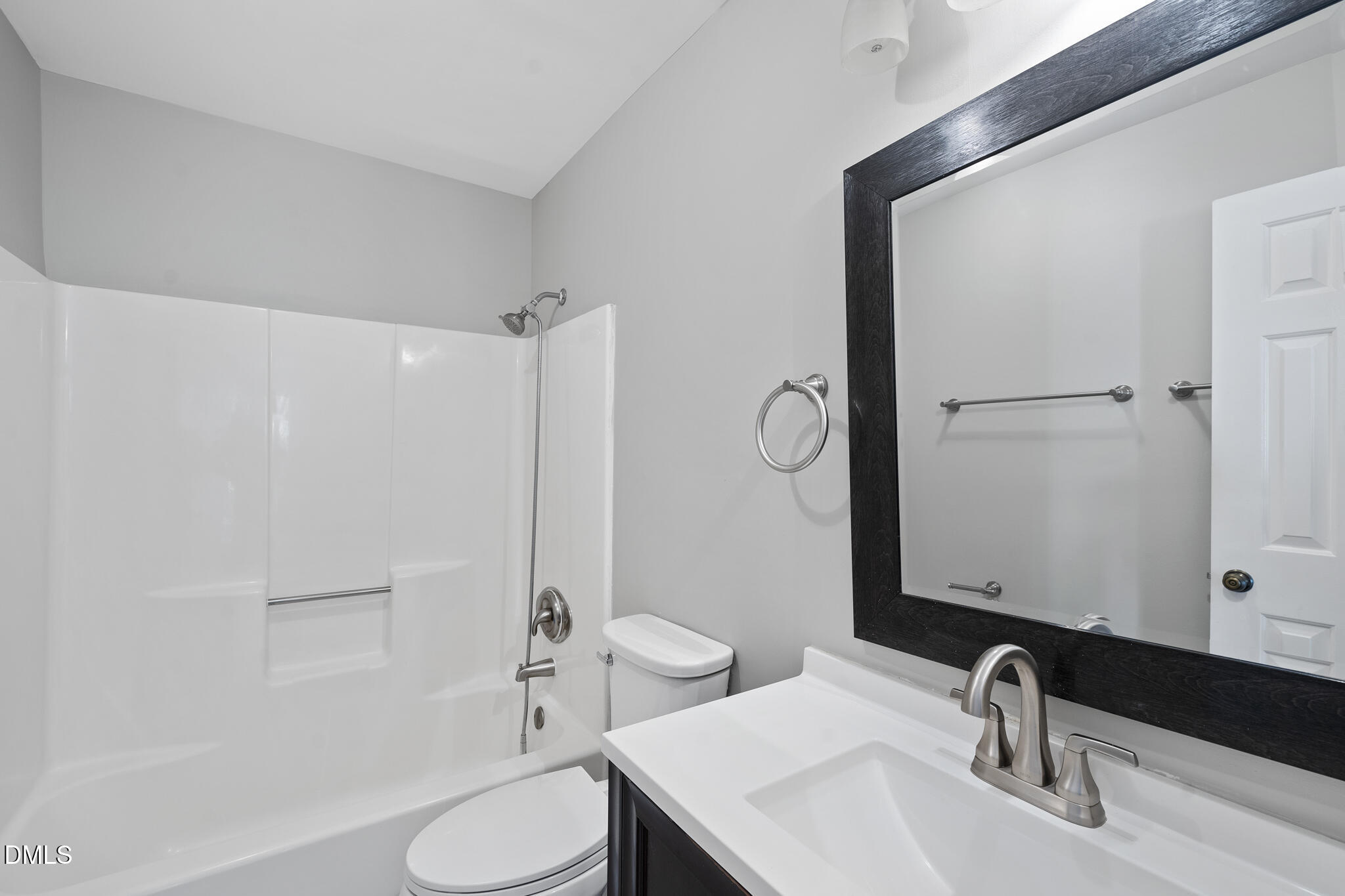 4601 Timbermill Court, Unit 104 Raleigh, NC 27612 - Photo 10 of 24 a bathroom with a sink toilet and shower