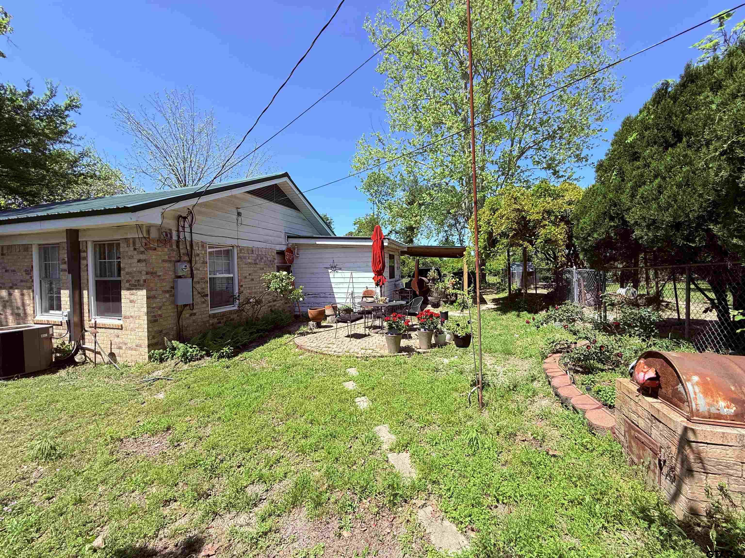 508 Whippoorwill Street Henderson, TX 75652 - Photo 23 of 24 a view of a house with backyard porch and sitting area
