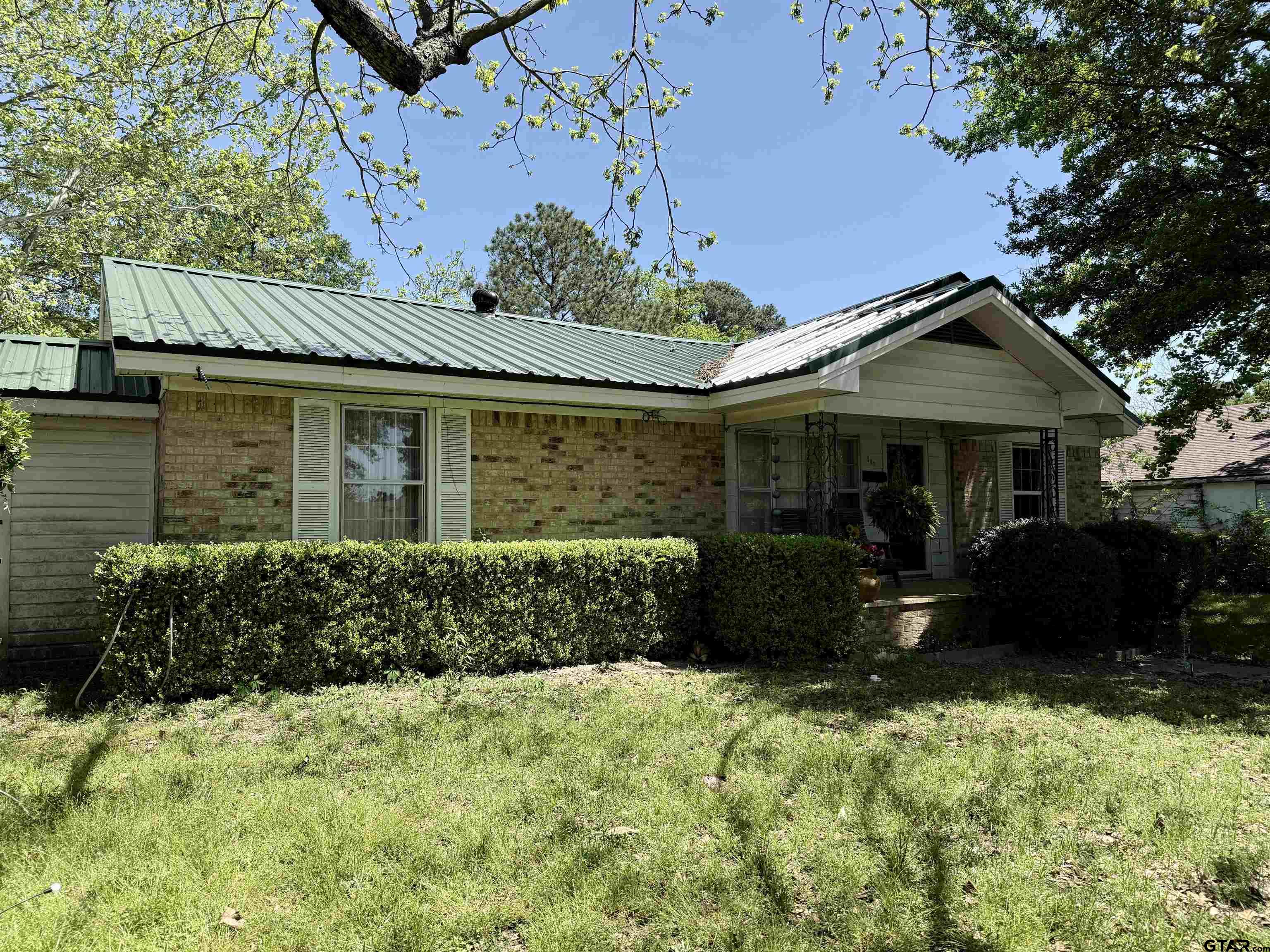 508 Whippoorwill Street Henderson, TX 75652 - Photo 3 of 24 front view of a house with a yard