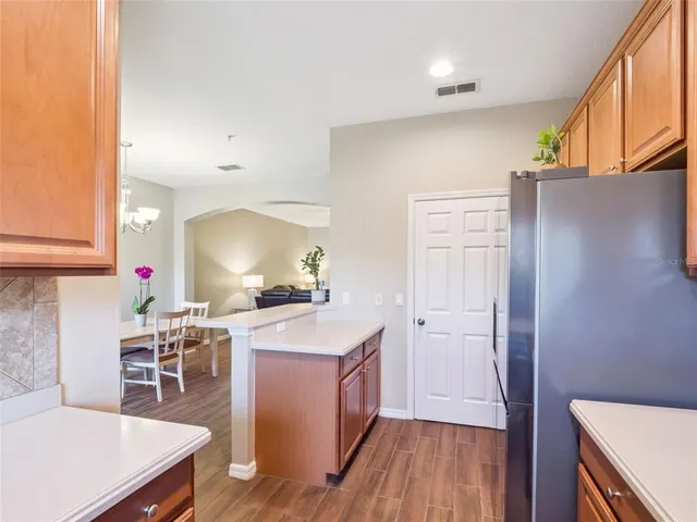 a kitchen with a sink and wooden cabinets