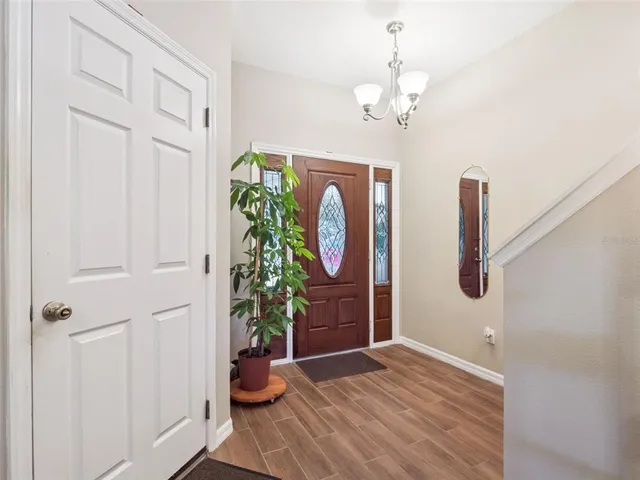 a view of an entryway with wooden floor