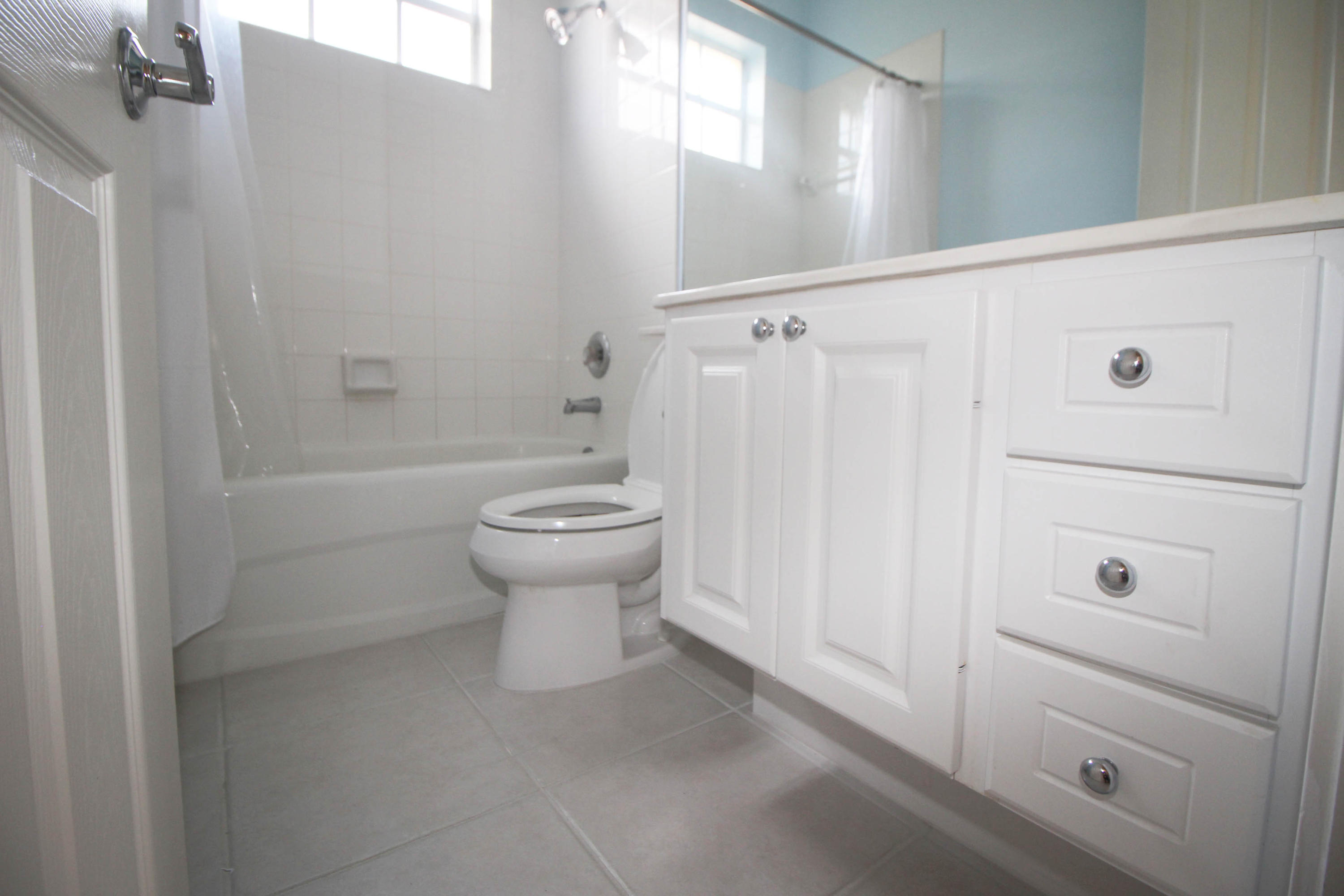 256 San Remo Drive Jupiter, FL 33458 - Photo 13 of 66 a bathroom with a sink a toilet and shower