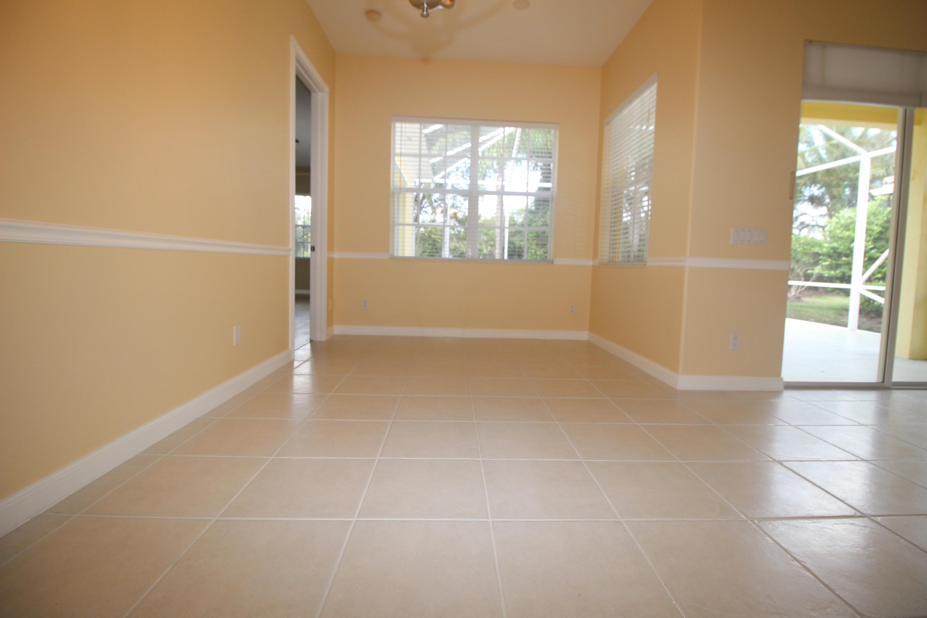 256 San Remo Drive Jupiter, FL 33458 - Photo 22 of 66 an empty room with windows and entrance