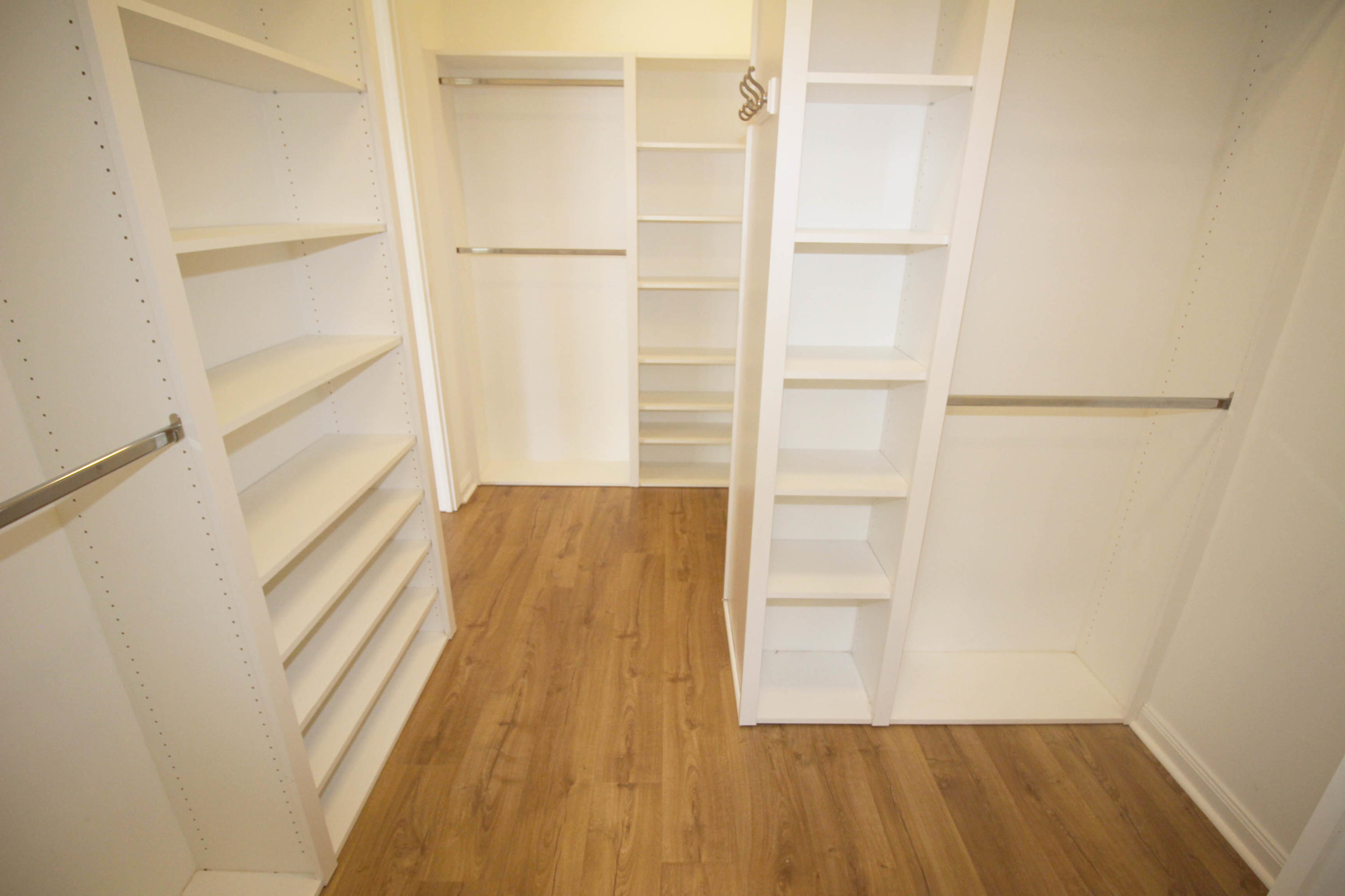 256 San Remo Drive Jupiter, FL 33458 - Photo 32 of 66 a view of walk in closet with empty racks