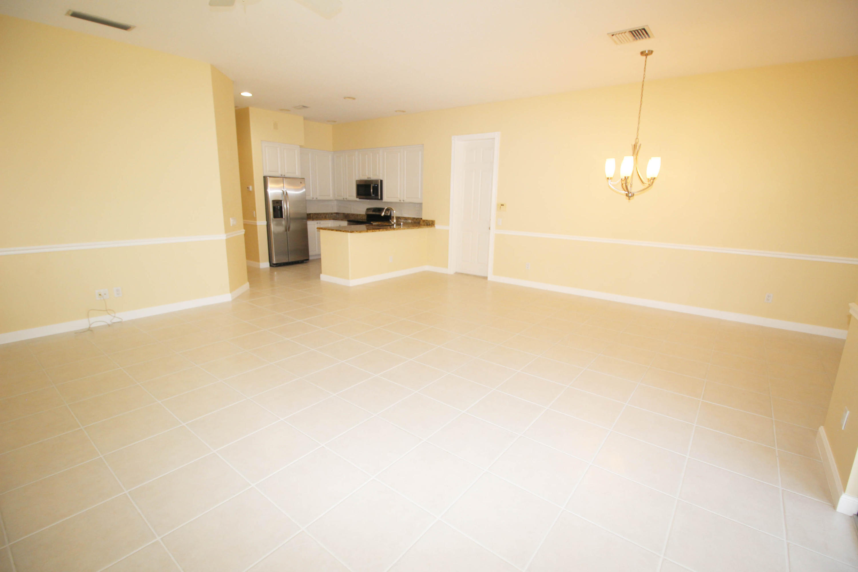 256 San Remo Drive Jupiter, FL 33458 - Photo 40 of 66 a view of a kitchen with a sink and cabinets