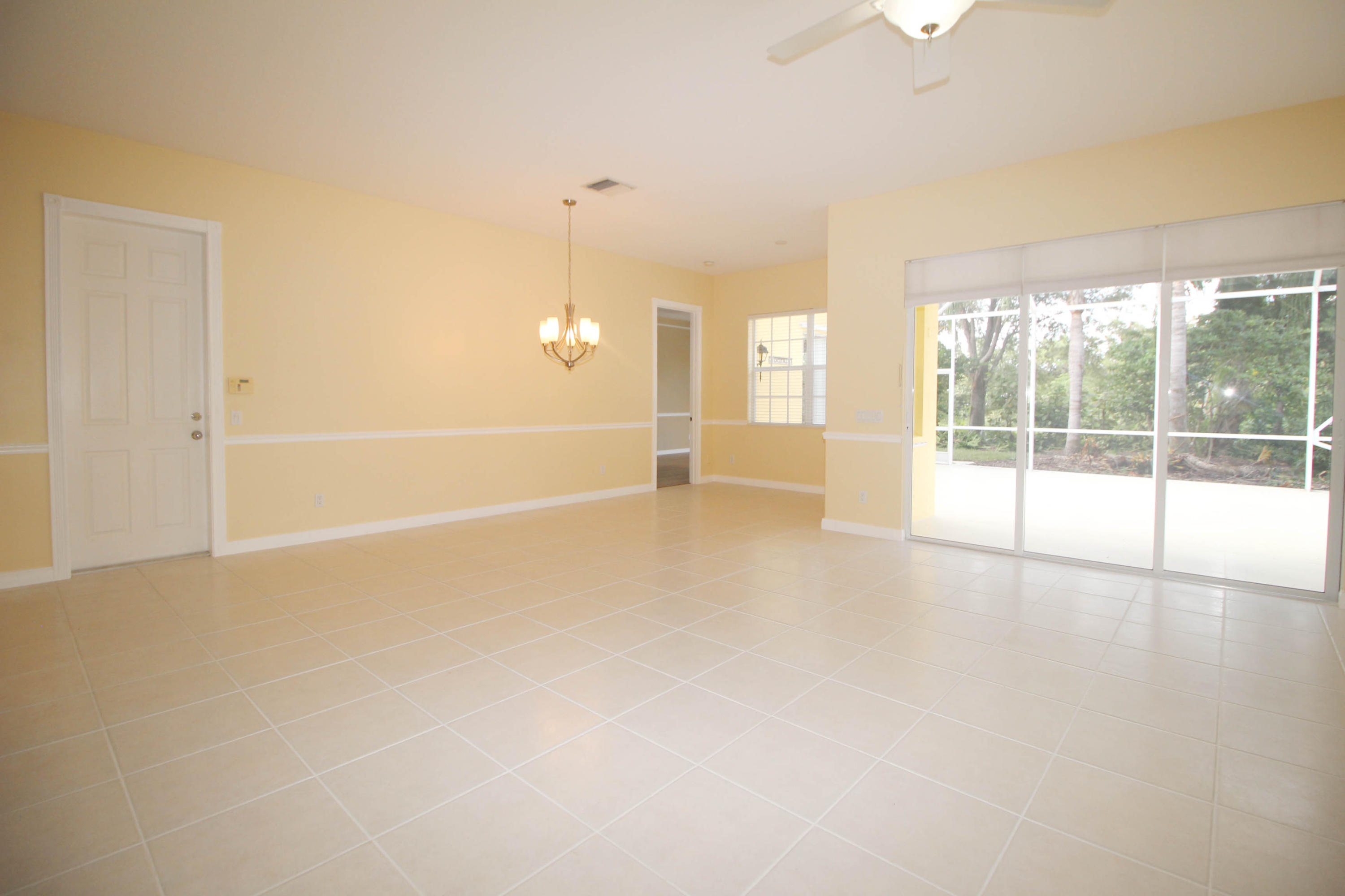 256 San Remo Drive Jupiter, FL 33458 - Photo 41 of 66 an empty room with large windows
