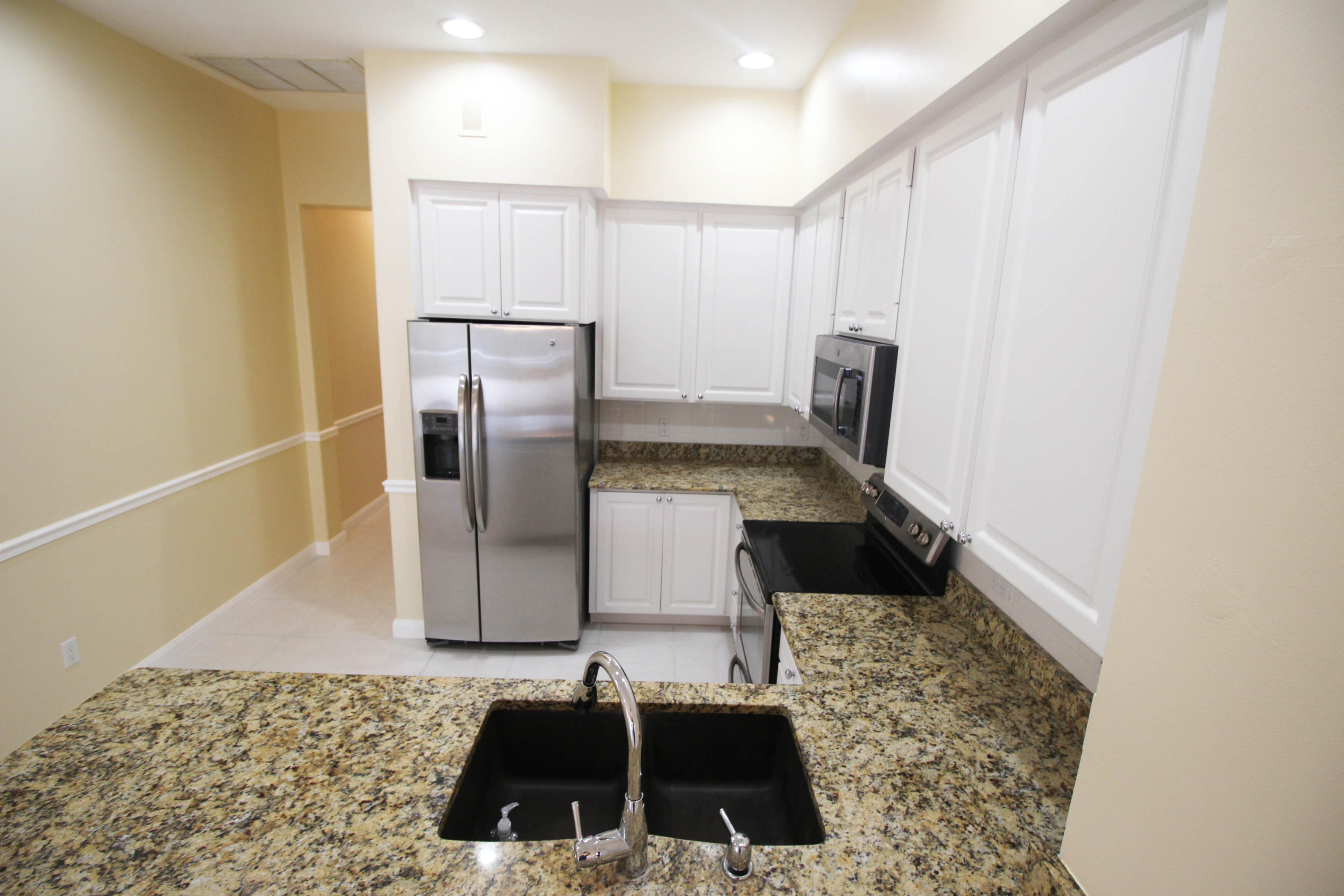 256 San Remo Drive Jupiter, FL 33458 - Photo 45 of 66 a bathroom with a sink and a washing machine