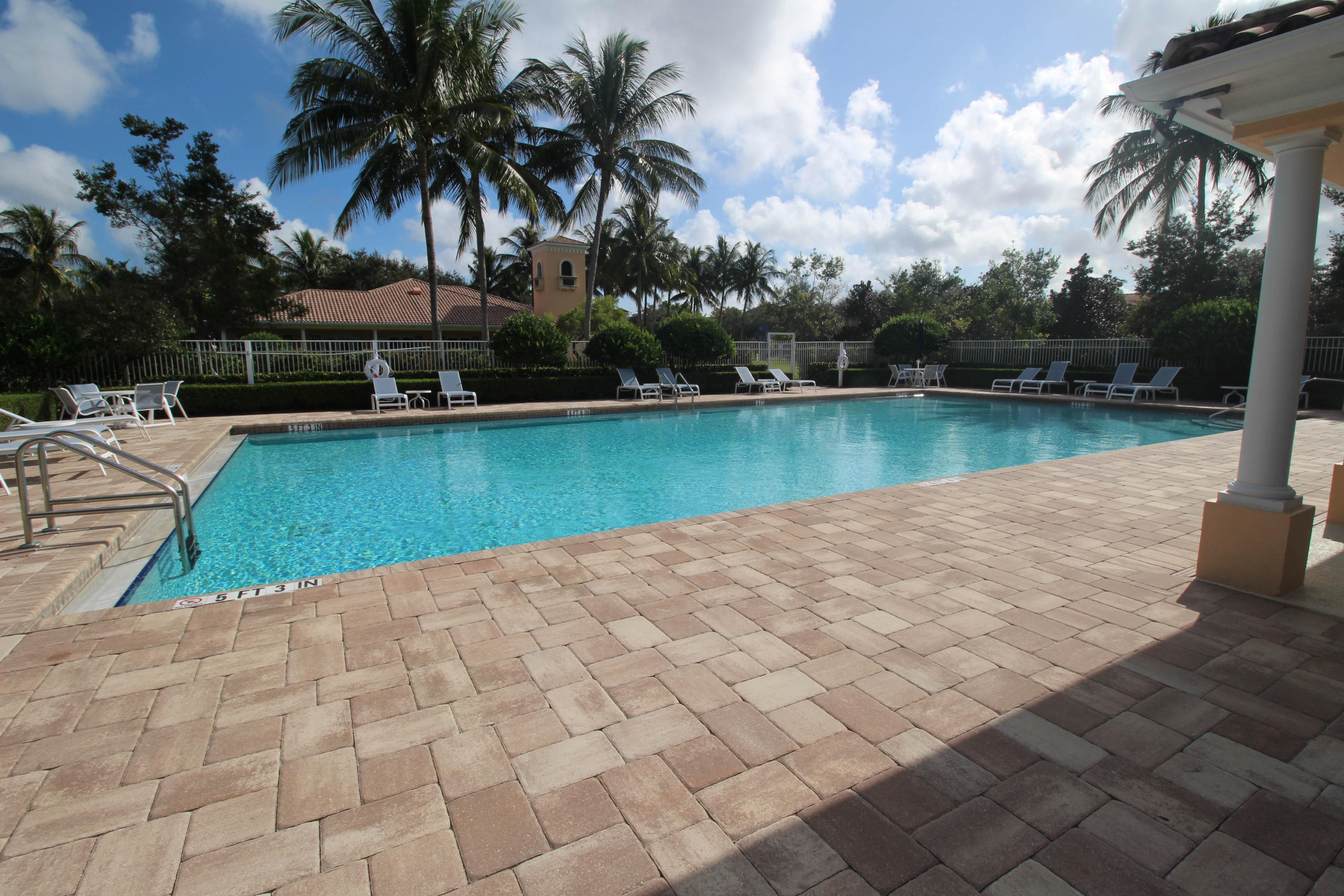 256 San Remo Drive Jupiter, FL 33458 - Photo 59 of 66 a view of swimming pool with lake and trees in the background