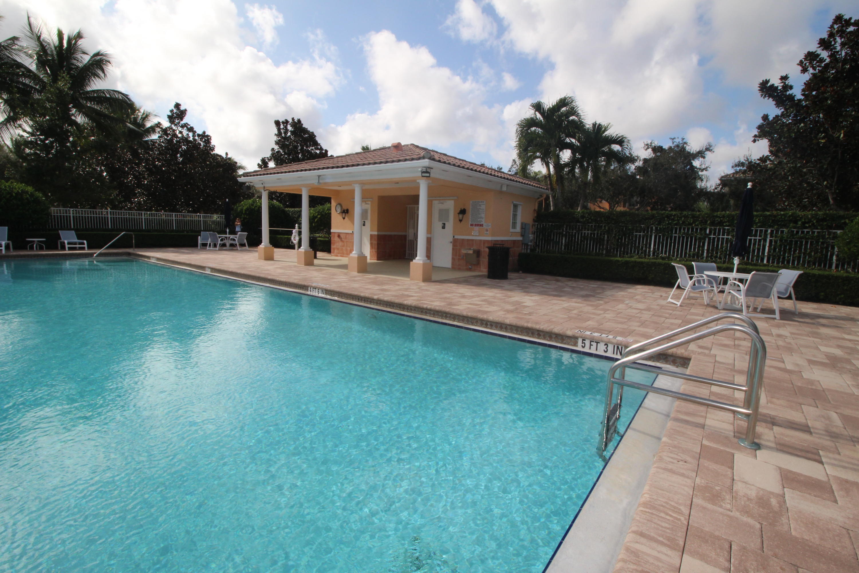 256 San Remo Drive Jupiter, FL 33458 - Photo 61 of 66 a view of house with swimming pool and yard with green space