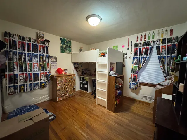 a view of a workspace with furniture and toys
