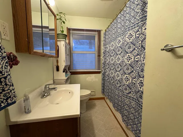 a bathroom with a sink and mirror