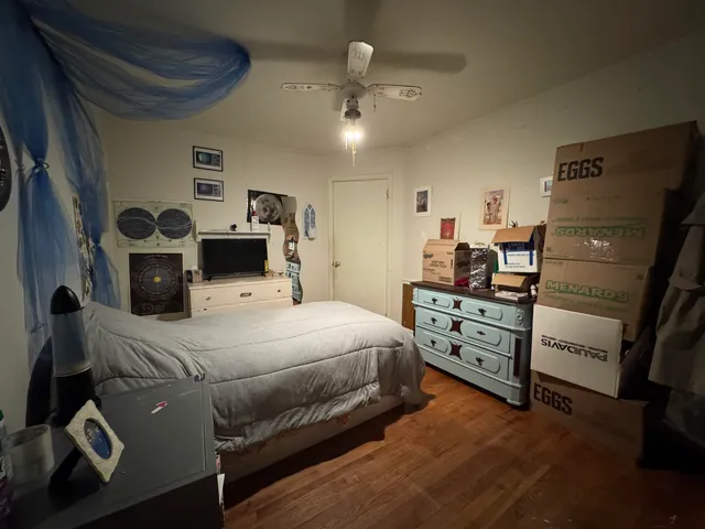 a bedroom with a bed and a dresser