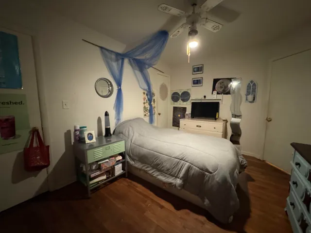 a bed room with a bed and a tv