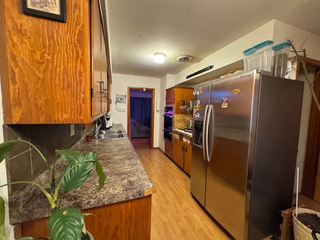 a view of a living room with washer and dryer