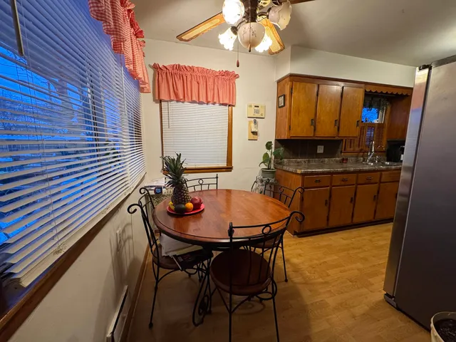 a dining room with table and chairs