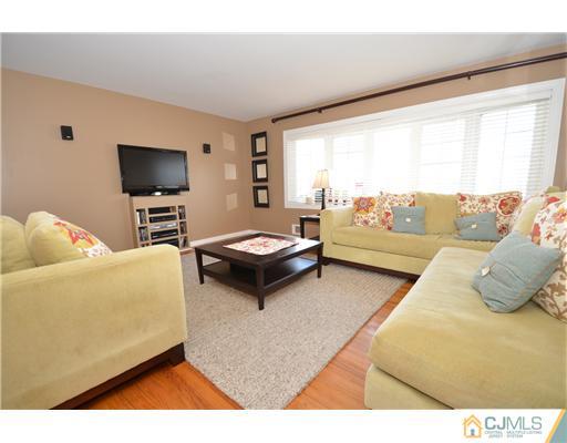38 Harvard Road Old Bridge, NJ 08859 - Photo 2 of 13 a living room with furniture and a flat screen tv