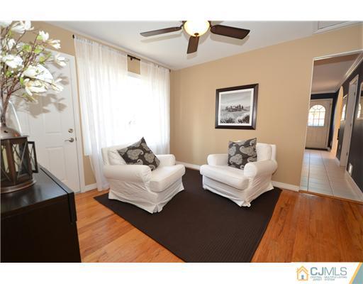 38 Harvard Road Old Bridge, NJ 08859 - Photo 11 of 13 a living room with furniture and a wooden floor