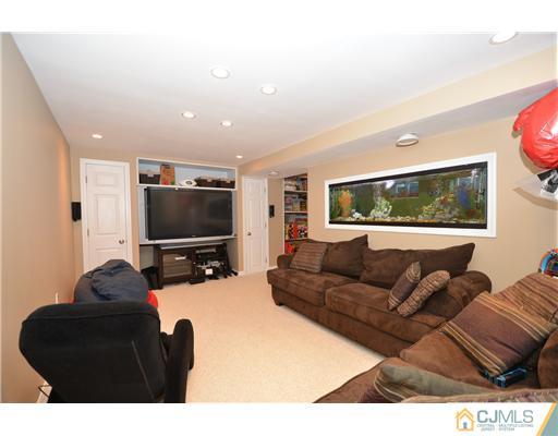 38 Harvard Road Old Bridge, NJ 08859 - Photo 13 of 13 a living room with furniture and a flat screen tv