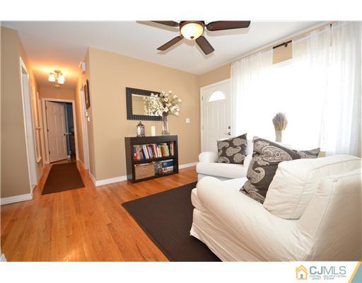 38 Harvard Road Old Bridge, NJ 08859 - Photo 5 of 13 a living room with furniture and a flat screen tv