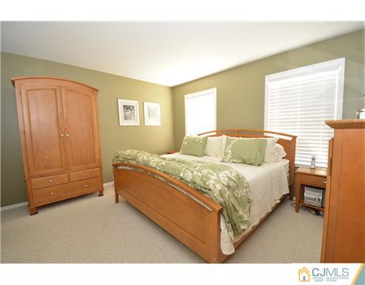 38 Harvard Road Old Bridge, NJ 08859 - Photo 6 of 13 a spacious bedroom with a bed and window