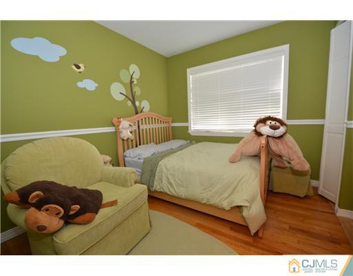 38 Harvard Road Old Bridge, NJ 08859 - Photo 9 of 13 a bedroom with two beds and painting on the wall
