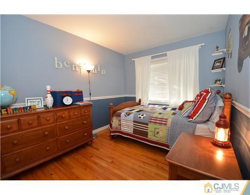 38 Harvard Road Old Bridge, NJ 08859 - Photo 10 of 13 a bedroom with bed and window