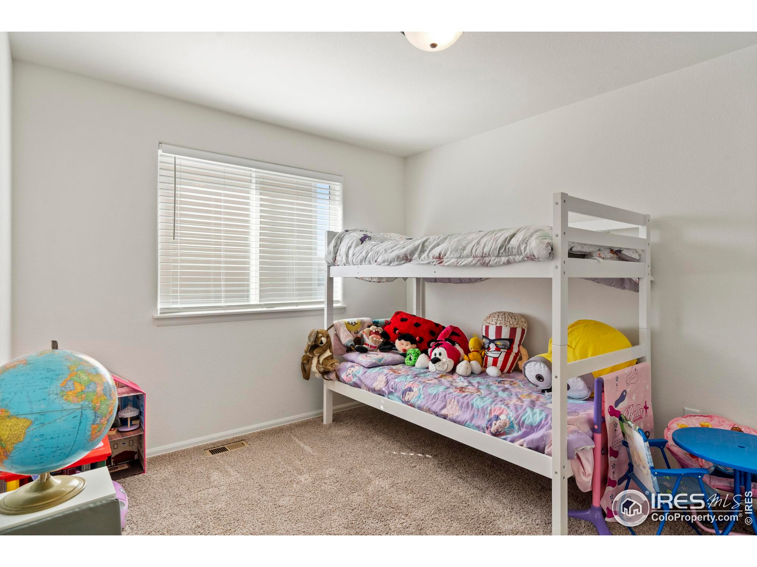 941 Barasingha Street Severance, CO 80550 - Photo 22 of 46 a bedroom with baby bed and window