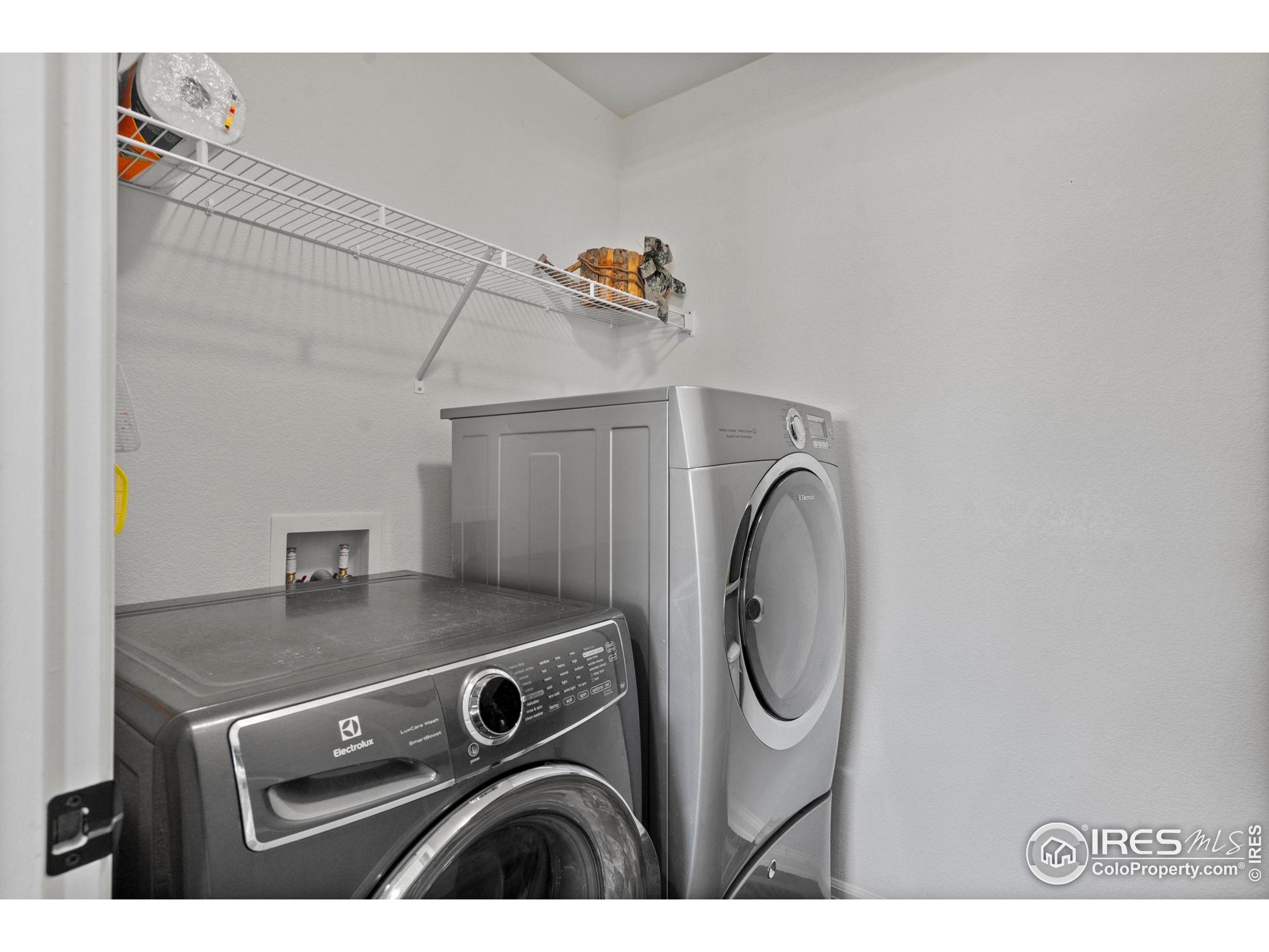 941 Barasingha Street Severance, CO 80550 - Photo 25 of 46 a utility room with dryer and washer