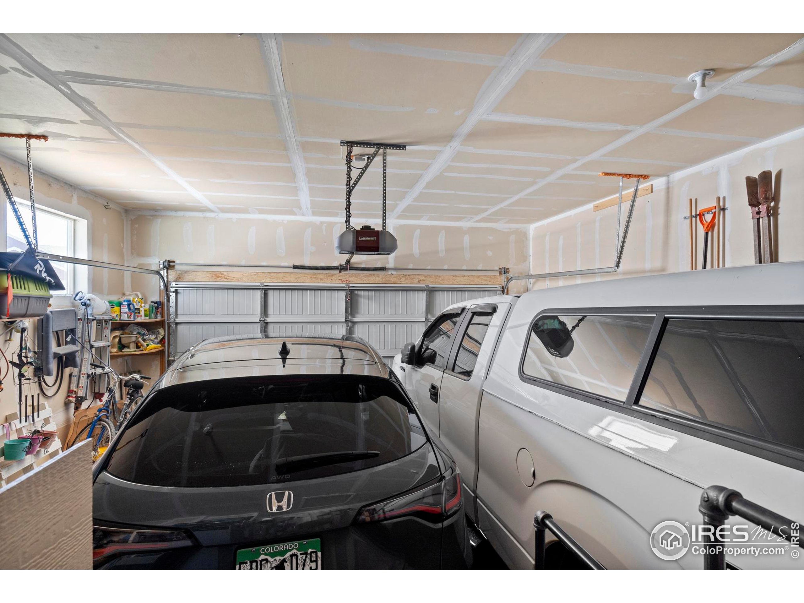 941 Barasingha Street Severance, CO 80550 - Photo 26 of 46 a white car parked in a parking garage