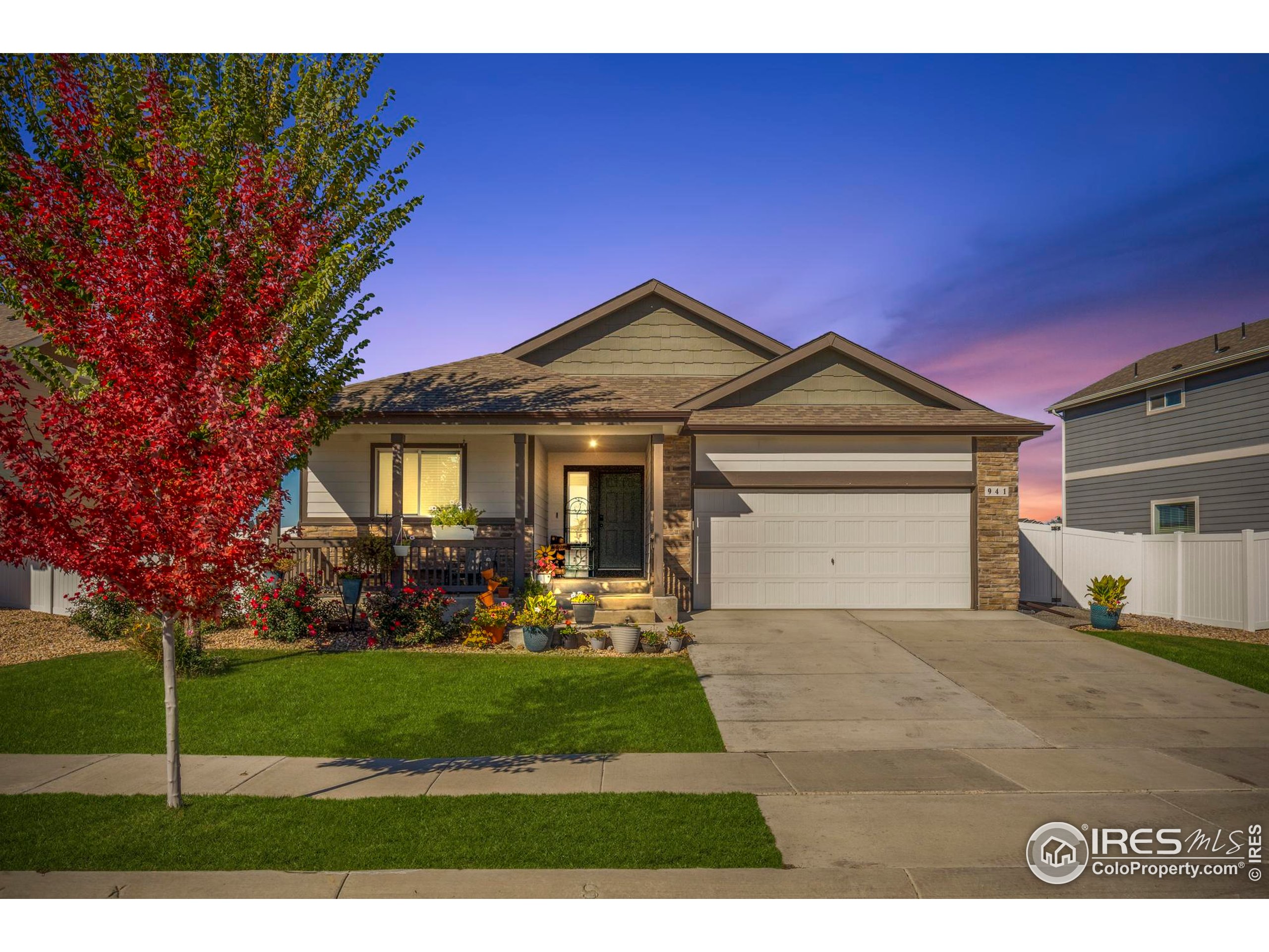 941 Barasingha Street Severance, CO 80550 - Photo 3 of 46 a front view of a house with a yard